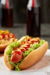 Hot dog with lettuce and tomato