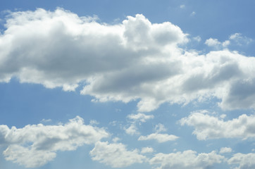Pink sky background with white clouds.