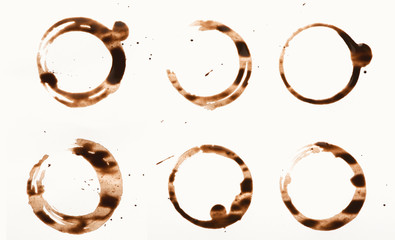 Collection of dry coffee cup stains on white background