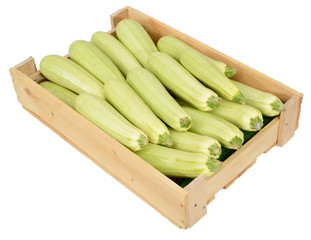 Zucchini in wooden box on white background