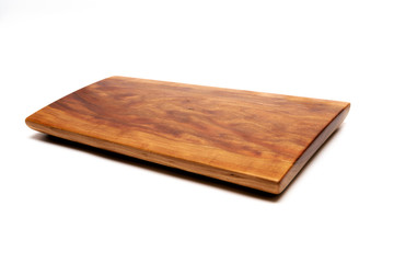 Isolated cutting board for use as a background.