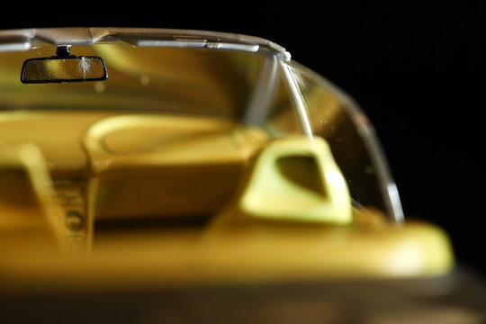 Miniature car model intentionally focus super macro at rear view mirror part. © eurostar1977