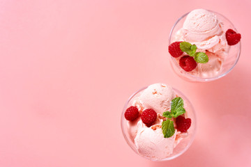 Rasberry ice cream balls served in glass dessert dishes
