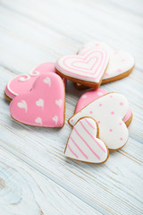 Homemade valentine cookies on wooden table