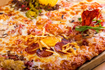 Obraz na płótnie Canvas square pizza with many different ingredients