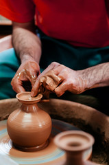 Man making pottery art, clay work close up hands shot shot