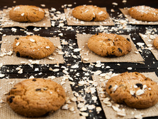 Homemade cookies  on a black vintage textured table.Tasty.