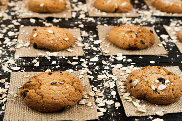 Homemade cookies  on a black vintage textured table.Tasty.