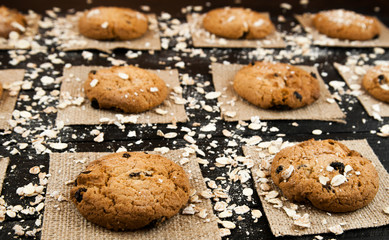 Homemade cookies  on a black vintage textured table.Tasty.