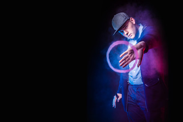 smoking vape. vaping man holding a mod. Vape Rings. A man launches a ring of smoke. Tricks with smoke. A man smokes an electronic cigarette. A large ring of smoke.