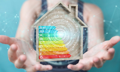 Businesswoman using 3D rendering energy rating chart in a wooden house