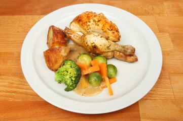 Roast poussin and vegetables