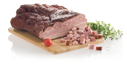 Delicious smoked slab bacon on a cutting board isolated on white background