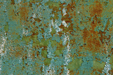 Old Metal Wall Background.Cracked Green Paint On An Old Metallic Surface, Rusted Green Painted Metal Wall, Rusty Metal With Cracked And Flaky Paint. Abstract Texture.