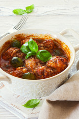 Meatballs and brussel cabbage stewed in tomato sauce