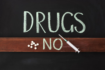 The inscription on a chalkboard "No drugs!"