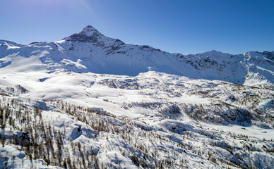 Valmalenco - Valtellina (IT) - Vista aerea panoramica invernale di Campagneda con Pizzo Scalino sul fondo