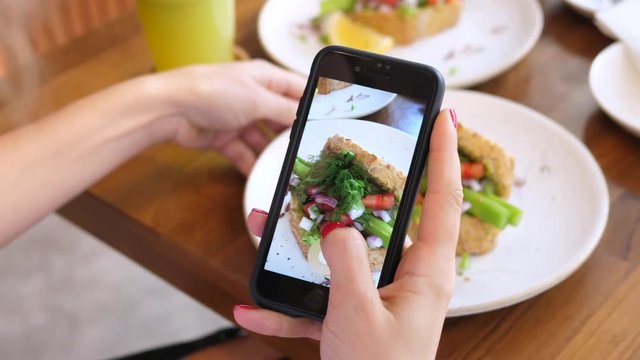 Female Hands Photographing Food By Smartphone