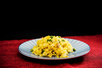 Homemade Chinese fried rice with vegetables and fried eggs