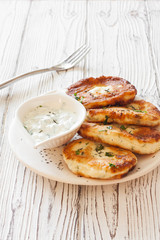 Cottage cheese pancakes or syrniki and yoghurt sauce