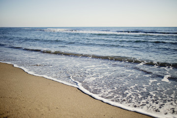 soft wave on the beach with a view of the horizon