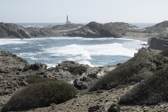 Lighthouse on the slate cape of Favaritx, Menorca, Balearic Islands, Spain