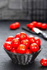 Tomatoes. Fresh tomatoes in basket on table