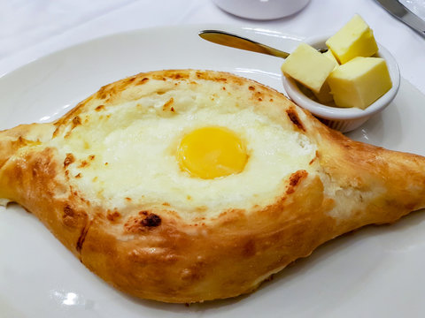 Khachapuri in Adjarian. Georgian national cheese pastry baked with egg
