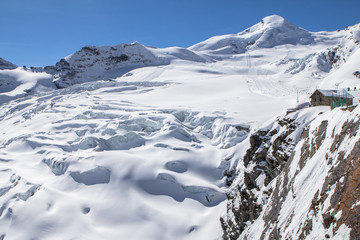 Snow-covered glacier in a Mountains of Saas-Fee in Switzerland