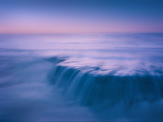Fototapeta premium dreamy and beautiful seascape with rock and long exposure on beach