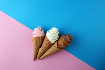 Vanilla frozen yogurt or soft ice cream in waffle cone.