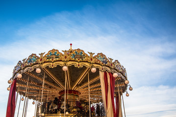 carousel ride spins in the air at sunset