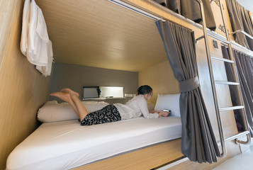 woman in capsule hotel