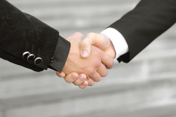 close up. handshake business partners on blurred background