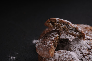 oatmeal cookies on a black table in castor sugar