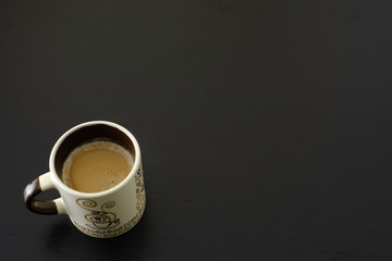 Coffee on black wooden table. Delicious coffee with space to enter your campaign.