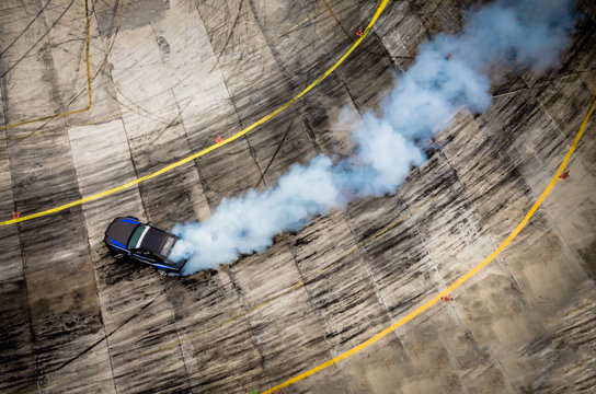 Top view of aerial from drone. Professional driver drift car on asphalt track.Motor sports concept.
