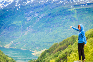 Woman tourist in norwegian mountains fjords