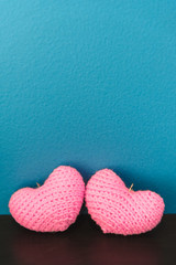 Two pink of crochet hearts