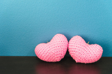 Two pink of crochet hearts