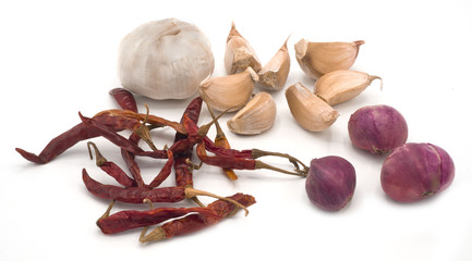 garlic, dried red chili, and onion isolated on white background