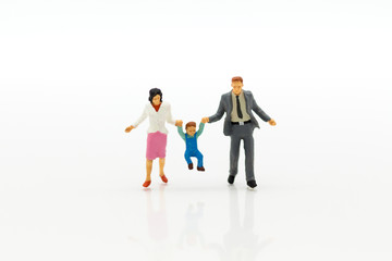 Miniature people: Family figure standing on white floor . Image use for background retirement planning, Life insurance concept.