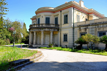 Fototapeta na wymiar The Mon Repos Palace wit its park in Corfu town, Greece