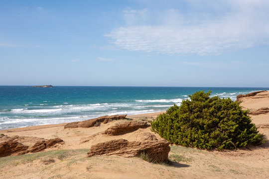 Sea beach at Lake Corission Lagoon with sandstones  in Corfu, Greece