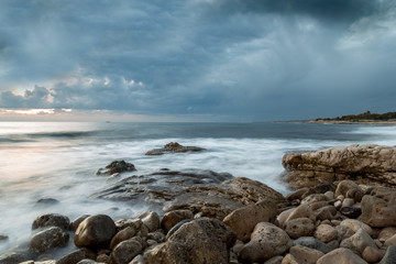 Fototapeta na wymiar Tramonto prima del temporale,panorama Salentino