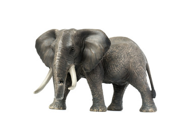 Fototapeta na wymiar Figurine of a elephant on a white background. Toy. Side view