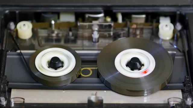 Seamless Loop of cassette tape fast forwarding and rewinding sequentially in the deck player. Tapes are the most popular analogue audio format ever created with over 30 billion blank or pre-recorded c