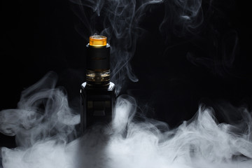 vape close-up in a smoke on a black background