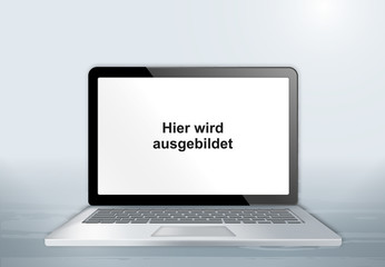 Fototapeta premium Laptop auf Holztisch - Hier wird ausgebildet