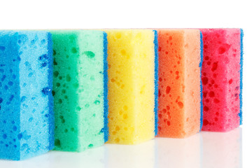 Five multi-colorful kitchen sponges for ware washing.
